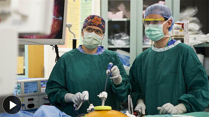 two doctors performing surgery